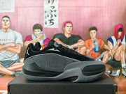 Side profile of a black and grey Jordan basketball sneaker with a patterned side panel, grey overlays, and visible Zoom branding.