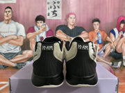 Rear view of cream and black Nike basketball shoes with 12 AM heel details.