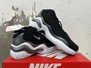 Pair of black and grey Nike sneakers displayed from the side.