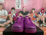 Front view of a pair of purple Nike basketball sneakers showing the lace-up design, padded tongues and tonal toe boxes.
