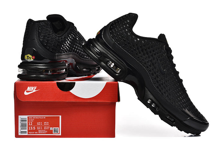 Black Nike Air Max Plus VII sneakers displayed with a shoebox