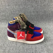 Front three-quarter view of the matching pair with red overlays, blue toe boxes, black laces, and furry collars.