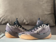 Pair of mauve-gray Air Jordan 39 sneakers viewed from the side.