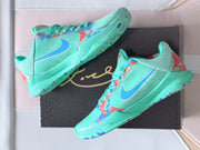 Angled views of the turquoise shoes showing side branding and multicolor details.