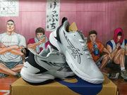 Pair of white and black basketball sneakers shown from the side and above