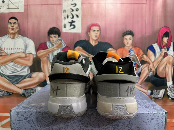 Rear view of white and grey basketball shoes with contrasting heel details