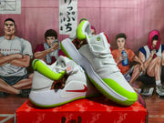 White and fluorescent green Nike basketball shoes shown from an angled side view, with red branding and illustrated upper graphics.