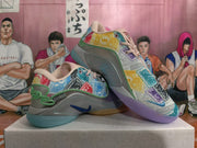 Angled view of the multicolor Nike basketball shoes with Monopoly-themed print and contrasting outsole colors.