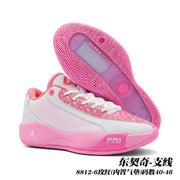 Pink and white Jordan 8812 basketball shoes shown with a pink outsole and patterned upper details.