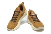 Top-front view of the brown sneaker pair showing the lace arrangement, padded collars, and tongue pull tabs.