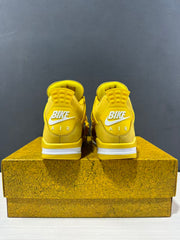 Rear view of the pair showing yellow heel panels, white branding details, and white midsole sections.