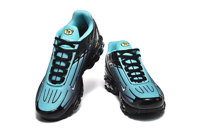 Pair of black and bright blue Nike Air Max Plus III sneakers shown from above and the front.