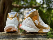 Rear and side views showing the heel structure and gold accents
