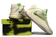 Cream and lime Nike Giannis Immortality 7 shoes beside a display box