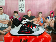 Side profile showing the graphic toe, red side detail, and Zoom Freak 1 midsole marking