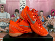 Angled product view of the orange and silver Nike Zoom basketball sneakers displayed together.