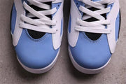 Close-up of the University Blue toe box, white lace panels, and white laces.