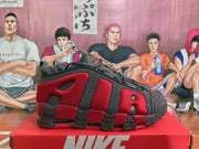 Side view of a red and black Nike sneaker showing layered overlays, textured red panels, and a segmented outsole.