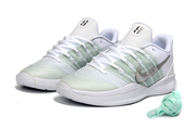 Pair of white and silver Nike Sabrina 3 shoes with pale green panels and silver side details