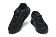 Pair of black Nike Air Max sneakers viewed from the front and above.