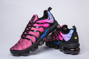 Nike sneakers shown from front and rear angles, highlighting the pink upper and blue accents.