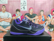 Side view highlighting the Nike Swoosh, black upper, purple collar, and purple outsole.