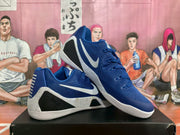 Angled view showing the white Nike Swoosh, black side panels, and speckled midsole.