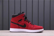 Lateral profile of a red and black high-top sneaker with a white midsole.