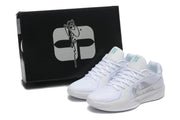 White Nike Sabrina 2 shoes pictured beside a black shoebox.