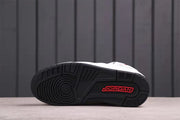 Bottom view showing the black patterned outsole with red Jordan branding