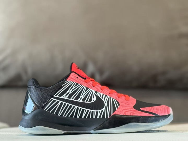 Side view of black, white, and red Nike Kobe 5 basketball shoe