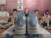 Rear view of white and blue Jordan 4-style sneakers showing blue heel panels, Jumpman logos, and layered soles.
