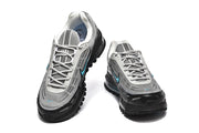 Pair of grey and black Nike Air Max 97-style sneakers with turquoise accents, shown from the front