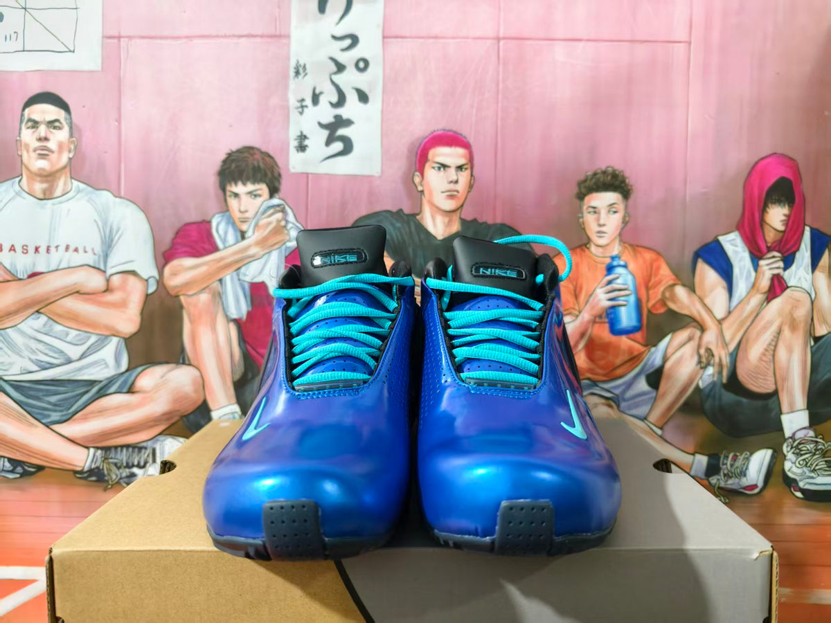 Front view of blue Nike basketball sneakers with turquoise laces and black tongues