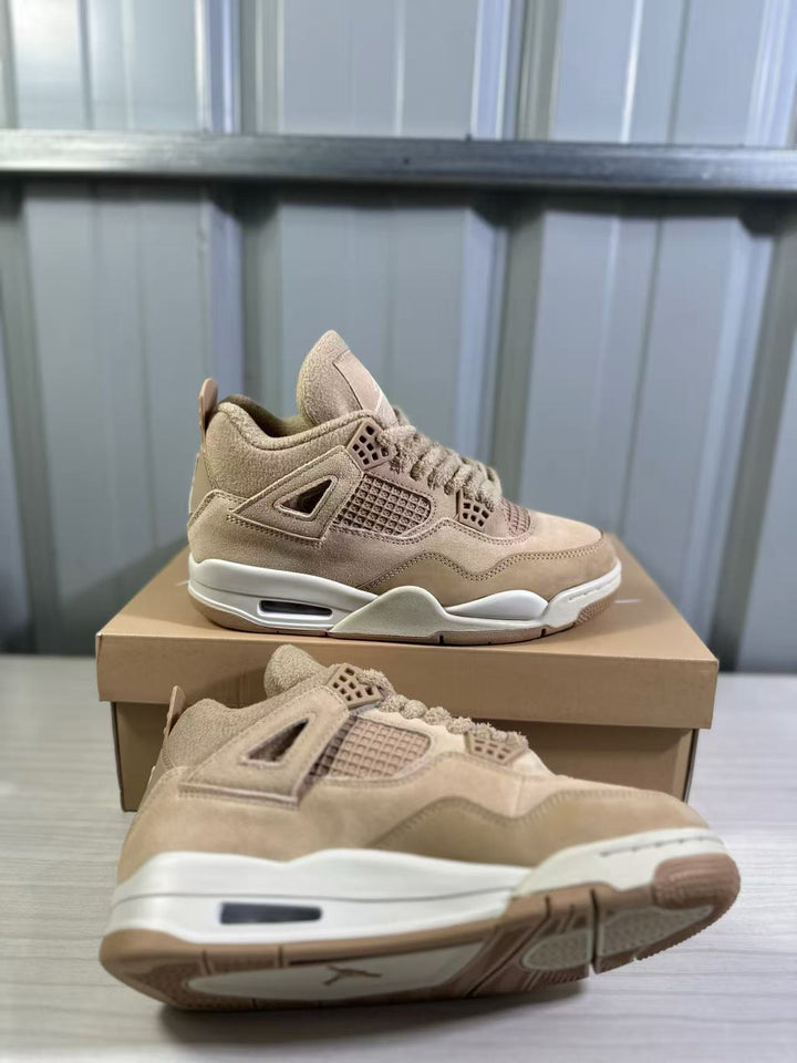 Pair of tan Jordan Air Jordan 4 Retro sneakers shown on and beside a shoebox.