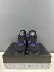 Front view of a pair of black Jordan Air Jordan 4 sneakers with purple-blue mesh panels and lace eyelets.