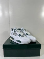 Front three-quarter view of the pair highlighting white laces, mesh panels, and green lace supports.