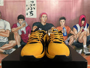 Front view of black and yellow Nike basketball shoes with yellow laces