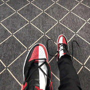 Top view of the black, red, and white color-blocked toe and tongue areas.