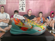Side profile of a multicolor Nike basketball sneaker with a gray swoosh, yellow laces, teal midsole sections, and a gray outsole.