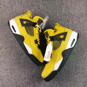 Overhead view of the pair showing the lace-up fronts, side mesh panels, and contrasting black and white sole elements.