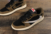 Angled view of the low-top sneakers showing the side Swoosh, brown overlays, and cream midsole.