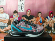 Side view showing the blue Swoosh and patterned upper
