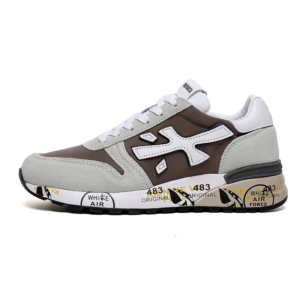 Side view of brown and light gray Premiata low-top sneakers with white laces and a printed sole