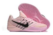 Side view and patterned outsole of a pink Nike Sabrina 2 basketball shoe