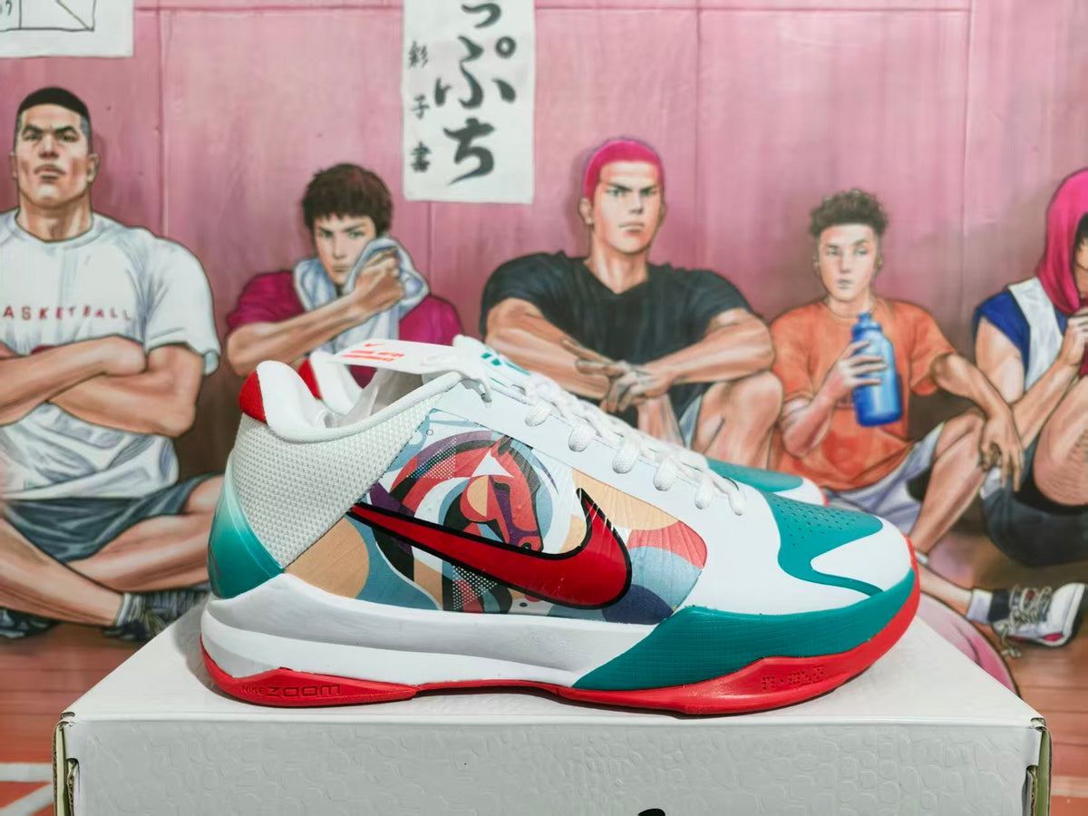 Side view of a white Nike basketball sneaker with teal and red accents, a multicolor graphic side panel, and visible Zoom branding.