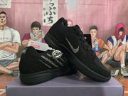 Angled view of the black sneaker pair showing the rhinestone-style Swoosh and side embellishments.