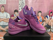 Angled view of purple Nike Kobe basketball shoes showing side and upper details