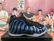 Side view of a blue and black high-top sneaker with a Nike Swoosh.
