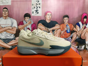 Side profile of a light beige Nike shoe with gray and teal accents and a visible side Swoosh.